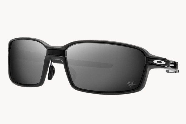 Oakley sunglasses featuring a sleek black frame and stylish grey lenses, perfect for outdoor activities and fashion.